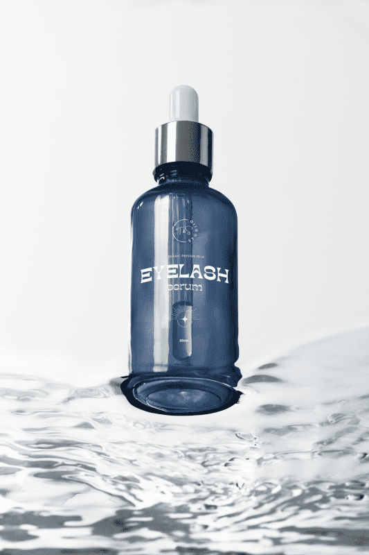 mockup-of-a-serum-dropper-standing-over-water-m38595 (1)